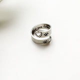 Bague réglable patte & cœur torsadés – Acier inoxydable