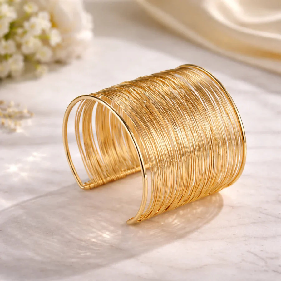 C-shaped gold bracelet