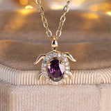 Collier pendentif tortue en cristal violet