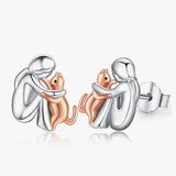 Boucles d'oreilles étreintes de chat bicolores argent et or