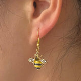 Boucles d'oreilles abeille dorée et nid d'abeille en cristal