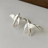 Magnifiques boucles d'oreilles clip hirondelle argentée